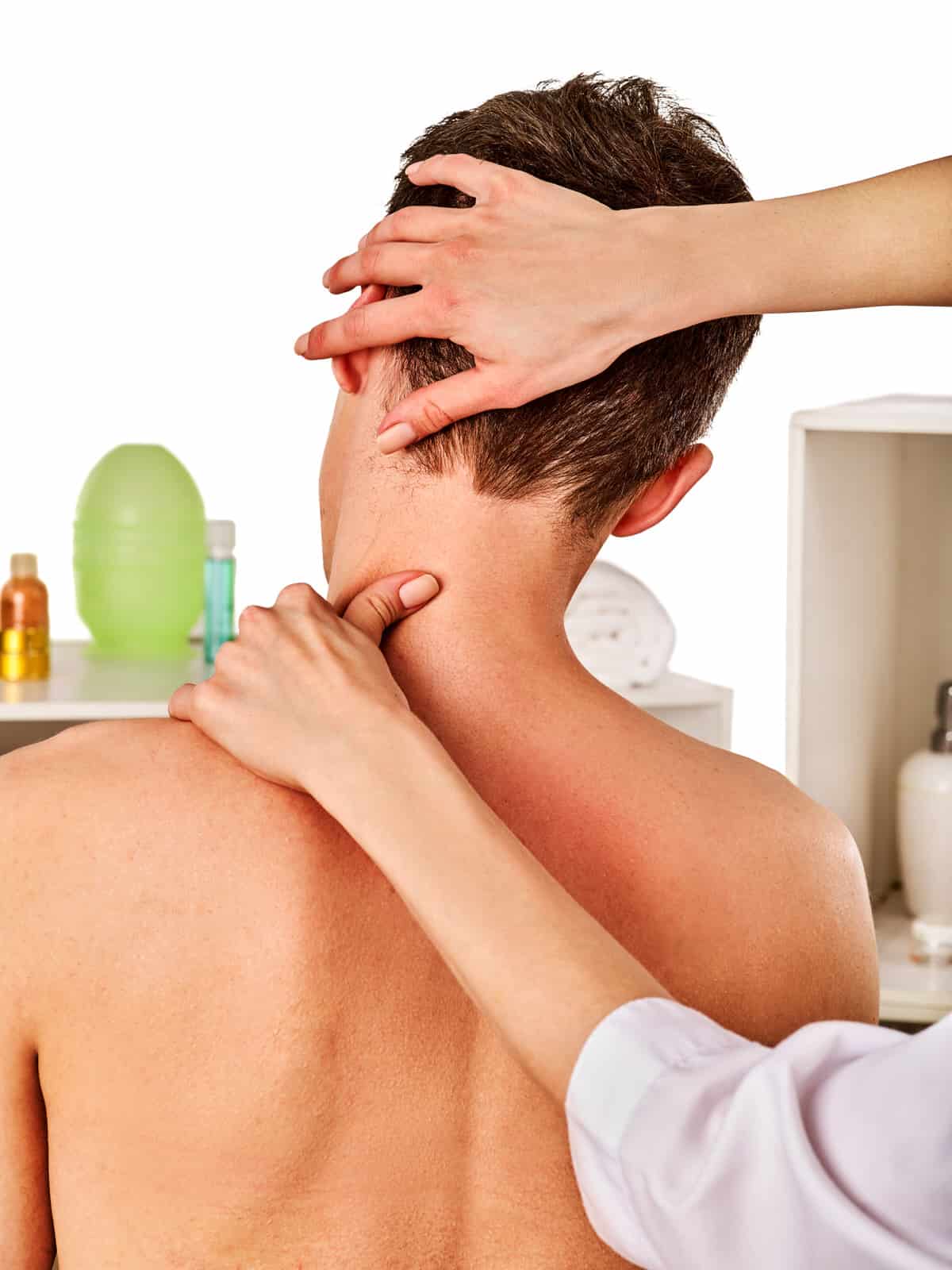 Shoulder and neck massage for woman in spa salon. Doctor making therapy in rehabilitation center . Reinforcement of joint in good clinic. Back view. Elimination of consequences of sports injuries.