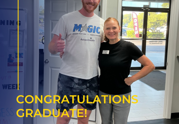 A tall man in a Magic t-shirt stands next to a smiling woman in a gym, both posing for a photo. The text says, Congratulations Graduate! We are so proud of you!.
